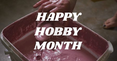 Photo for Image of happy hobby month text over hands of caucasian man forming pottery. hobby and celebration concept digitally generated image. - Royalty Free Image