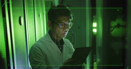 Photo for Image of data processing over asian male worker in server room. Global business and digital interface concept digitally generated image. - Royalty Free Image
