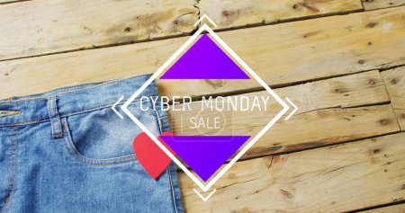 Photo for Image of cyber monda sale text over denim trousers on wooden background. Sales, retail, shopping, digital interface, communication, computing and data processing concept digitally generated image. - Royalty Free Image