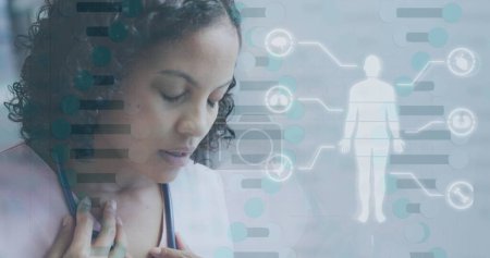 Image of dna strand and medical data processing over biracial female doctor. Global healthcare, science, medicine, research, computing and data processing concept digitally generated image.