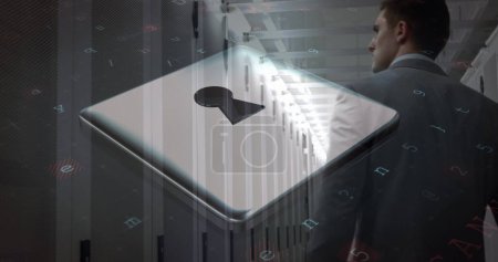 Image of cyberattack and padlock icon over caucasian man in server room. global data processing, computing and digital interface concept digitally generated image.