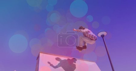Image of colourful spots over caucasian man skateboarding. global sport and digital interface concept digitally generated image.