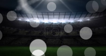 Photo for Image of failing spots and glowing lights over football stadium. World cup soccer concept digitally generated image. - Royalty Free Image