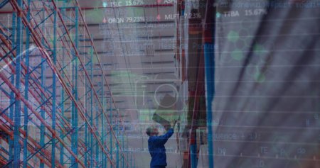 Image of financial data processing over caucasian man in warehouse. global shipping, delivery and connections concept digitally generated image.