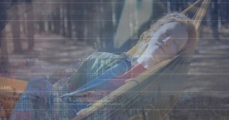 Photo for Image of digital data processing over caucasian woman on a hammock. Global connections, data processing and digital interface concept digitally generated image. - Royalty Free Image