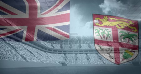 Foto de Un estadio está adornado con las banderas del Reino Unido y Fiyi. La imagen simboliza un evento deportivo entre las dos naciones. - Imagen libre de derechos