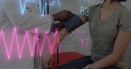 Photo for Image of colourful cardiographs over diverse patient and doctor taking pressure. Medicine, health and digital interface concept, digitally generated image. - Royalty Free Image