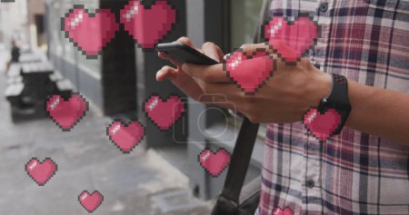 Photo for Image of heart icons floating over man using smartphone. social media and communication interface concept digitally generated image. - Royalty Free Image