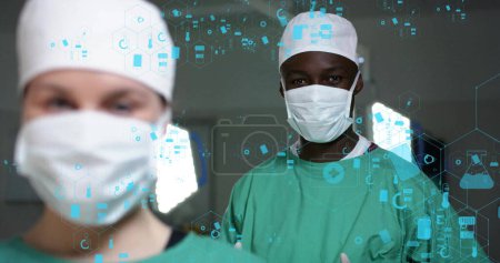 Bild von dna strang über verschiedene Chirurgen im Krankenhaus. Globale Medizin, Gesundheitswesen, Verbindungen, Computer- und Datenverarbeitungskonzept digital generiertes Bild.