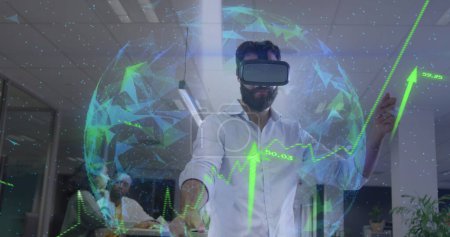 Photo for Image of globe, arrows and data processing over businessman wearing vr headset in office. Global business, finances, computing and data processing concept digitally generated image. - Royalty Free Image