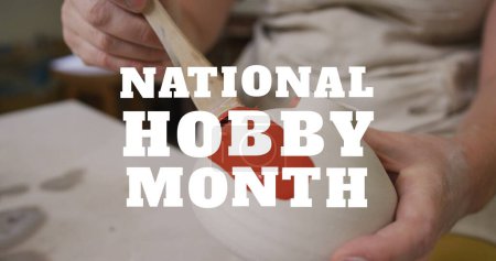 Image of national hobby month text over midsection of caucasian woman painting pottery. hobby and lifestyle concept digitally generated image.