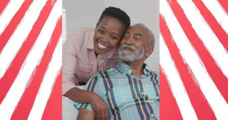 Image of flag of usa framing african american father and adult daughter. american patriotism, independence and celebration concept digitally generated image.