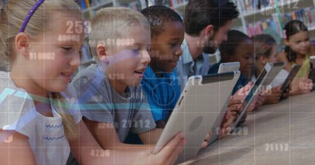 Image of data processing over diverse schoolchildren and teacher using tablets in classroom. Global education, computing and digital interface concept digitally generated image.