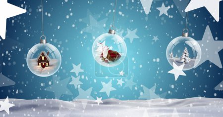 Photo for Image of christmas bubbles and stars with snow falling on blue background. Christmas, tradition and celebration concept digitally generated image. - Royalty Free Image