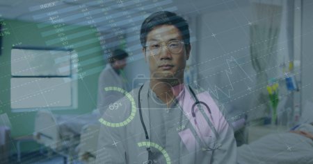 Photo for Image of graphs and infographic interface over smiling asian doctor standing in hospital. Digital composite, multiple exposure, report, business, global, medical, healthcare, technology concept. - Royalty Free Image