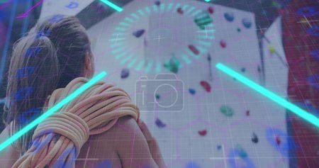 Image of data processing over caucasian woman climbing wall. Global sports, science, computing, digital interface and data processing concept digitally generated image.
