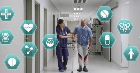 Image of medical icons over diverse female doctor helping male patient walk with crutch. Medical and healthcare services concept digitally generated image.