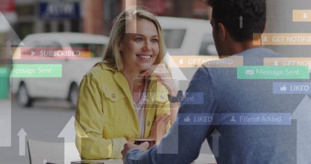 Photo for Image of social media icons floating over happy caucasian couple talking and drinking coffee. social media and communication interface concept digitally generated image. - Royalty Free Image