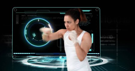 Image of female boxer with scope scanning and data processing. global sport, competition, technology, data processing and digital interface concept digitally generated image.