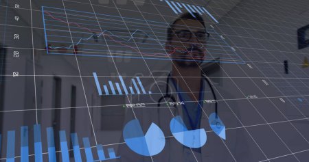Image of financial data and world map over caucasian male doctor. finance, economy, medicine, health and technology concept digitally generated image.