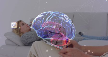 Image of digital brain over caucasian woman consulting psychologist. Mental health, therapy and healthcare concept digitally generated image.