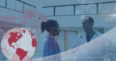 Image of globe and data processing over diverse doctors at hospital. Global medicine, healthcare and digital interface concept digitally generated image.