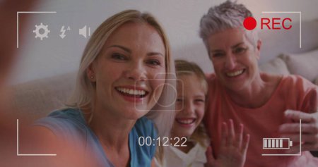 Photo for Image of play screen over caucasian family taking selfie. communication technology and online education at home digitally generated image. - Royalty Free Image