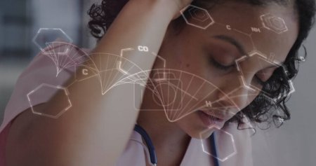 Image of data processing over tired biracial female doctor. Global healthcare, science, medicine, research, computing and data processing concept digitally generated image.