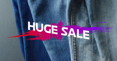 Photo for Image of huge sale text over denim trousers background. Sales, retail, shopping, digital interface, communication, computing and data processing concept digitally generated image. - Royalty Free Image