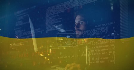 Image caucasian male hacker and data processing over flag of ukraine. ukraine crisis, cyber warfare and international politics concept digitally generated image.