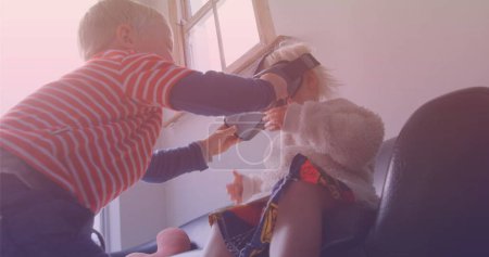 Image of smiling caucasian siblings playing with vr headset. national siblings day and celebration concept digitally generated image.