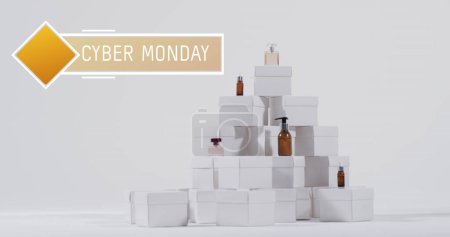 Photo for Image of cyber monday text over beauty products and boxes. Sales, retail, cyber shopping, digital interface, communication, computing and data processing concept digitally generated image. - Royalty Free Image