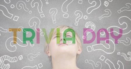 Photo for Trivia day text banner against multiple question mark symbols over caucasian boy. trivia day and education concept - Royalty Free Image