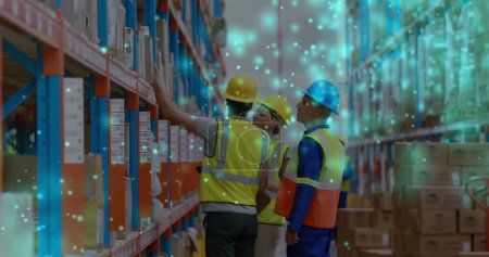 Image of glowing spots over diverse people working in warehouse. labor day, work, workers, tradition and celebration concept digitally generated image.