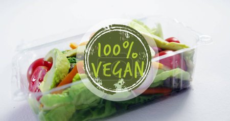 Photo for Image of 100 percent vegan text over box with fresh vegetables. Vegan food, fresh fruit and vegetables concept digitally generated image. - Royalty Free Image