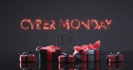Photo for Image of cyber monday text over gift boxes. Sales, retail, cyber shopping, digital interface, communication, computing and data processing concept digitally generated image. - Royalty Free Image