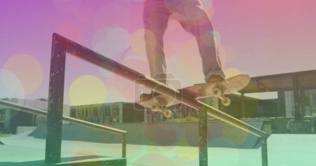 Photo for Image of colourful spots over caucasian man skateboarding. global sport and digital interface concept digitally generated image. - Royalty Free Image