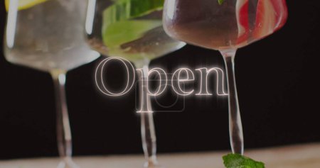 Photo for Image of open neon text and cocktails on black background. Party, drink, entertainment and celebration concept digitally generated image. - Royalty Free Image