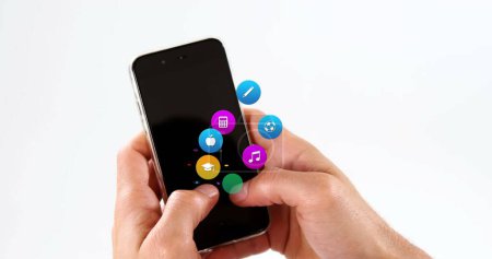 Image of colorful icons over hands using smartphone. Global social media, icons and digital interface concept digitally generated image.