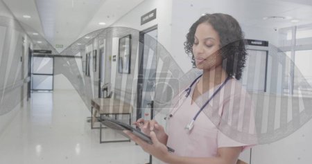 Image of dna and data processing over biracial female doctor. Global healthcare, science, medicine, research, computing and data processing concept digitally generated image.