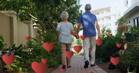 Photo for Image of falling hearts over caucasian senior couple walking. International day of older persons concept digitally generated image. - Royalty Free Image
