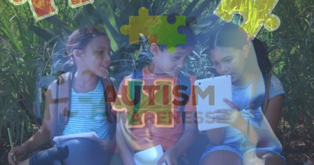 Image of colourful puzzle pieces and autism text over kids friends using electronic devices. autism, learning difficulties, support and awareness concept digitally generated image.
