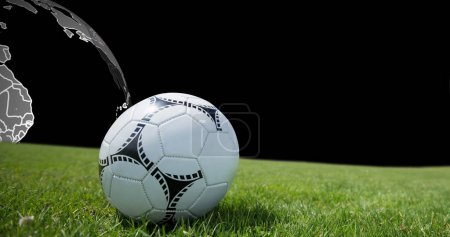 Photo for Image of football ball on grass over globe. World cup soccer concept digitally generated image. - Royalty Free Image