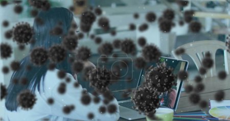Photo for Image of covid 19 cells a over businesswoman on laptop image call. global covid 19 pandemic concept digitally generated image. - Royalty Free Image