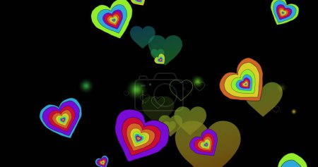 Image of rainbow hearts over black background. Pride month, lgbtq, human rights and equality concept digitally generated image.