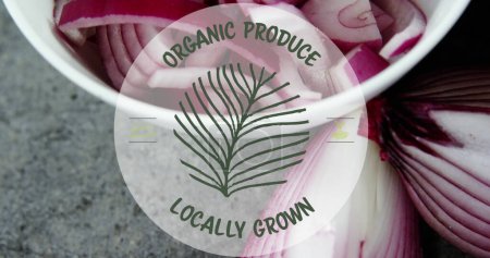 Photo for Image of organic produce locally grown text banner over bowl of chopped onions on grey surface. Vegan, organic and healthy food concept - Royalty Free Image