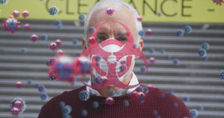 Téléchargez les photos : Image de 19 cellules covid sur un homme âgé portant un masque facial. global covid 19 pandémie et concept de vaccination image générée numériquement. - en image libre de droit