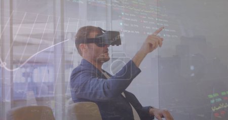 Photo for Image of financial data processing over man wearing vr headset. Global connections, business, finance, computing and data processing concept digitally generated image. - Royalty Free Image