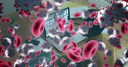 Foto de Imagen de 19 células covid y glóbulos rojos sobre empresaria usando laptop. global covid 19 pandemia concepto de imagen generada digitalmente. - Imagen libre de derechos