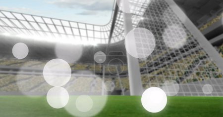 Photo for Image of failing spots and glowing lights over football stadium. World cup soccer concept digitally generated image. - Royalty Free Image